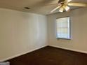 Bedroom with carpet flooring and ceiling fan at 7978 Woodlake Dr, Riverdale, GA 30274