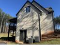 Brick house with a screened porch and attached garage at 100 Regina Ct, Fayetteville, GA 30215