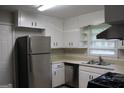 Kitchen with stainless steel appliances and ample cabinet space at 126 E Mimosa Dr, Jonesboro, GA 30236
