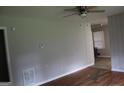 Bright living room featuring hardwood floors and a ceiling fan at 126 E Mimosa Dr, Jonesboro, GA 30236