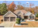 Attractive home with two-car garage and manicured lawn at 93 Lakesprings Dr, Mcdonough, GA 30252