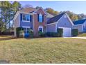 Two-story house with brick and gray siding, and landscaping at 108 Greenland Dr, Mcdonough, GA 30253