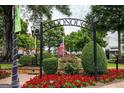 Scenic town square with archway entrance and lush landscaping at 205 Weldon Rd # 44, Mcdonough, GA 30253