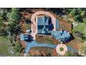 Overhead view of house, detached garage, and driveway at 242 Kirkley Rd, Tyrone, GA 30290