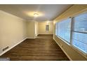 Bright living room featuring hardwood floors and large windows at 2798 Engle Nw Rd, Atlanta, GA 30318