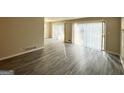 Living room with grey laminate flooring and sliding glass doors at 2302 Montrose Dr, East Point, GA 30344