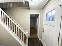 Bright entryway with staircase, hardwood floors, and view to living room at 2852 Port Royal Ln, Decatur, GA 30034