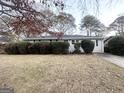 Gray exterior house with landscaping and a driveway at 2030 Fargo Se Pl, Atlanta, GA 30316