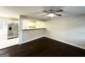 Open living room with dark hardwood floors and kitchen views at 2030 Fargo Se Pl, Atlanta, GA 30316