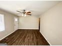 Spacious living room with dark laminate wood flooring at 3800 Clovis Nw Ct, Atlanta, GA 30331