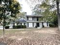 Two-story house with balcony, freshly painted, and landscaping at 2252 Wellington Hills Way, Snellville, GA 30039