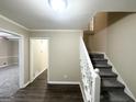 Interior view showing staircase with dark hardwood floors and light walls at 2252 Wellington Hills Way, Snellville, GA 30039