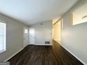 Spacious living area featuring dark laminate floors and neutral decor at 2312 Leslie Brook Dr, Decatur, GA 30035