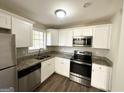 Modern kitchen with granite countertops and stainless steel appliances at 4448 Malibu Dr, Decatur, GA 30035