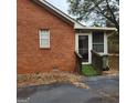 Brick home with a screened porch and ramp at 240 Chambers Rd, Mcdonough, GA 30253