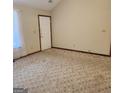 Spacious living room with neutral carpeting at 240 Chambers Rd, Mcdonough, GA 30253