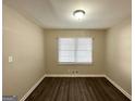 Spacious bedroom with hardwood floors and window blinds at 239 Silver Springs Sw Cir, Atlanta, GA 30310