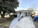 Updated ranch home features a covered carport and landscaped yard at 239 Silver Springs Sw Cir, Atlanta, GA 30310
