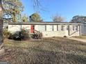 Newly renovated Ranch home with red front door and landscaping at 3438 Maryvale Dr, Decatur, GA 30032