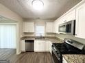 Modern kitchen with granite countertops and stainless steel appliances at 3438 Maryvale Dr, Decatur, GA 30032