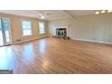 Living room with hardwood floors, fireplace, and access to patio at 4106 Duesenberg Dr, Tucker, GA 30084