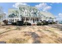 Two-story house with green roof, white siding, and large front porch at 2800 S Highway 16, Carrollton, GA 30116