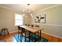 Bright dining room with hardwood floors and a rustic wood table at 2872 Cartwright Drive Dr, Decatur, GA 30033