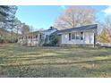 Side view of a ranch home with stone foundation at 435 Crabapple Rd, Fayetteville, GA 30215