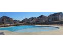 Curved community pool with plenty of space for swimming and relaxation at 103 Eagles Perch Rd, Loganville, GA 30052