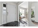 Bright entryway with view into dining room and hardwood floors at 453 Camp Hill Ln, Jonesboro, GA 30238