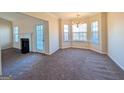 Bright dining area with bay window, fireplace, and access to kitchen at 6195 Winston Trce, Mcdonough, GA 30252