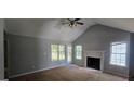 Spacious living room featuring a fireplace and vaulted ceiling at 221 Lakeview Dr, Stockbridge, GA 30281