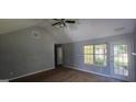 Bright living room with backyard access and vaulted ceiling at 221 Lakeview Dr, Stockbridge, GA 30281