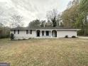 Newly renovated ranch home with a well-manicured lawn at 4395 Stonewall Tell Rd, College Park, GA 30349