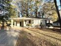 Ranch style home with a well-maintained lawn and driveway at 2442 Graywall St, East Point, GA 30344