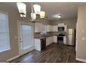 Modern kitchen with stainless steel appliances and granite countertops at 1768 Glen View Way, Hampton, GA 30228