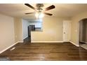 Living room with new flooring and view into kitchen at 3444 Orchard Cir, Decatur, GA 30032