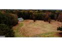 Cleared land with a small building and trees at 5300 Salem Rd, Covington, GA 30016