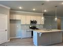 Modern kitchen with island, stainless steel appliances at 3851 Shelleydale Dr # 91, Powder Springs, GA 30127