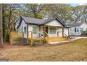 Newly renovated white house with wooden deck at 1955 Maywood Nw Pl, Atlanta, GA 30318