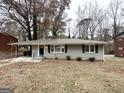 Charming single-story home with a gray brick exterior and autumn leaves at 1581 Mcclelland Ave, Atlanta, GA 30344