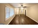 Bright living area with wood-look floors, large windows, and an entrance at 1581 Mcclelland Ave, Atlanta, GA 30344