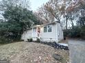 Single-story home with driveway, front yard, and landscaping at 2353 Arno Ct, Atlanta, GA 30318