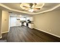 Open-concept kitchen and living area with modern appliances and wood-look flooring at 2353 Arno Ct, Atlanta, GA 30318
