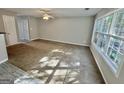 Living room with plush carpet and windows with natural light at 1030 Chase Ln, Mcdonough, GA 30253