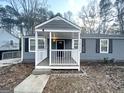 Close-up view of the front porch and entrance of a single-story home at 2556 Godfrey Nw Dr, Atlanta, GA 30318