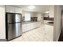 Modern kitchen with white cabinets, granite counters, and stainless steel appliances at 6069 Wisteria Ln, Lithia Springs, GA 30122