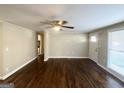 Spacious living room with hardwood floors and neutral walls at 6069 Wisteria Ln, Lithia Springs, GA 30122