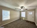 Bright and airy living room with neutral walls and carpeted floors at 2843 Marco Nw Dr, Atlanta, GA 30318