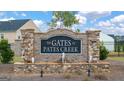 Community entrance with stone and brick signage and water feature at 671 Edgar St, Hampton, GA 30228